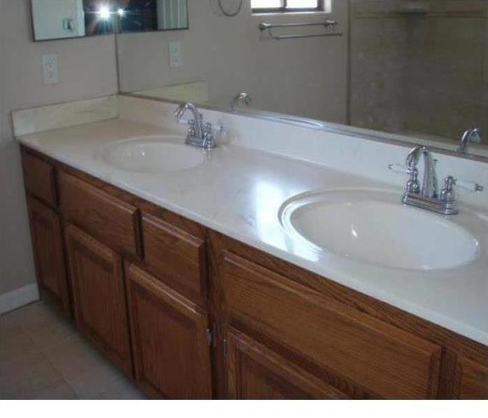 Clean bathroom double sink with mirrors