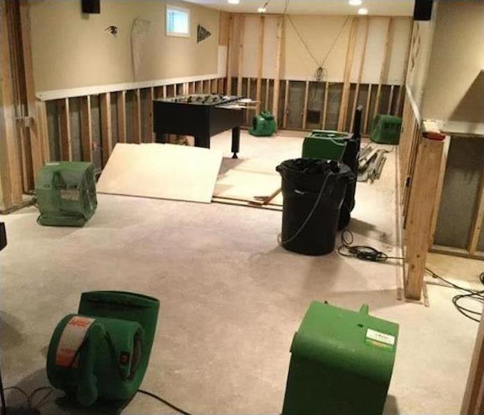 Exposed framework and SERVPRO drying equipment