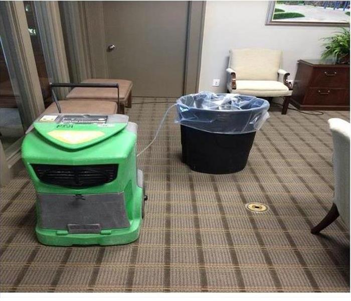 Gray commercial carpet with SERVPRO drying equipment 